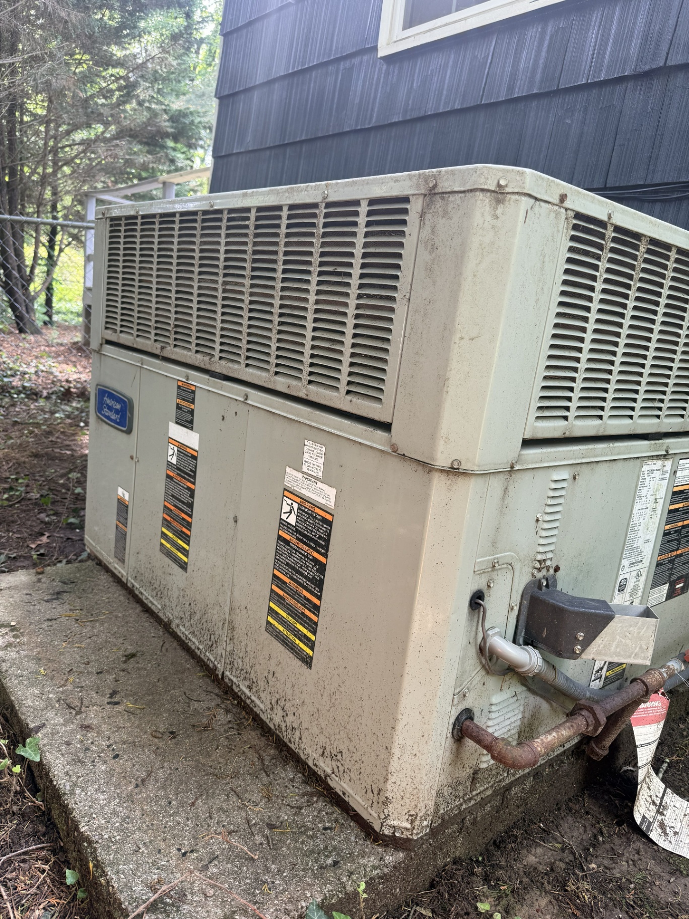 Aged American Standard packaged HVAC unit on a service call in the Chattanooga area