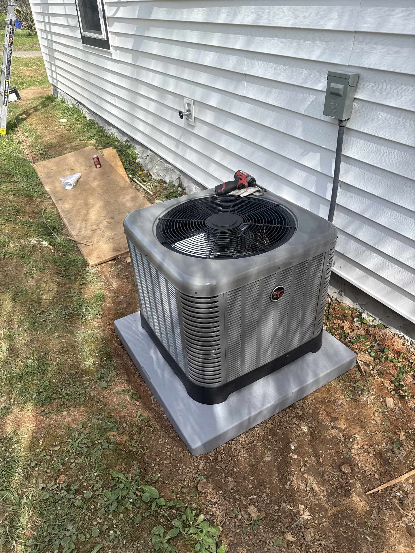 New Ruud condenser installed on a composite pad at a Chattanooga area home